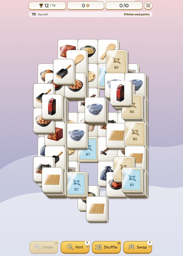 A Relax Mahjong board of tiles showing Japanese kitchen items such as bowls, chopsticks and a bamboo mat